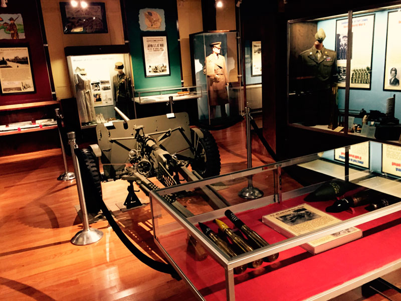 A room full of museum artifacts and exhibits inside the Lewis Army Museum.